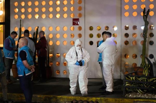 Forensic investigators exit the hotel where former One Direction singer Liam Payne, was found dead after falling from a balcony in Buenos Aires, Argentina, Wednesday, Oct. 16, 2024.